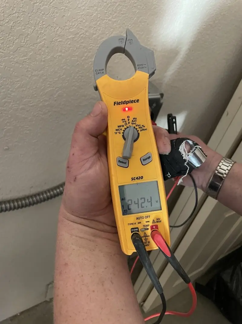 Voltage testing with clamp meter during Outlet Installation in Leawood
